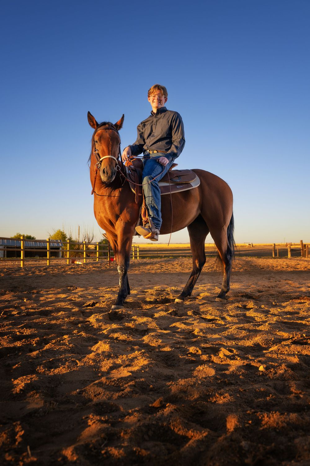 A Broomfield Senior sits on horseback stands against a bright blue sky in the desert at sunset, creating a panoramic sequence of views.