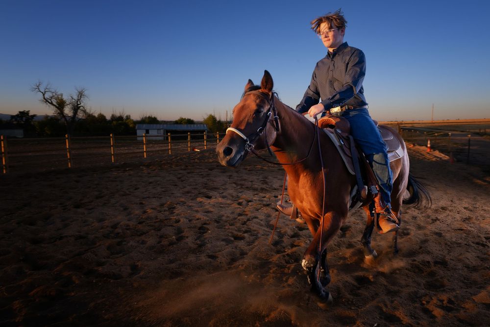 A Broomfield Senior rides on horseback against a bright blue sky in the desert at sunset, creating a panoramic sequence of views.