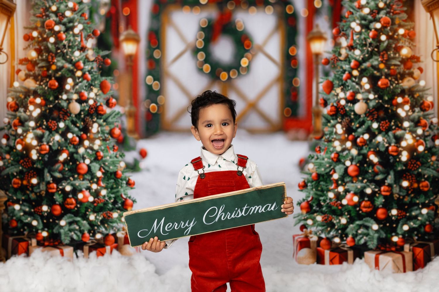 Festive Christmas scene with decorated trees, red bows, and wrapped presents in front of a wooden lattice wall.