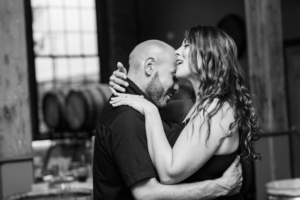 A romantic black and white photo collage showing couples kissing in various intimate moments.
