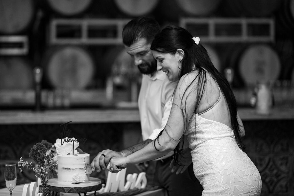 A collection of black and white wedding photographs showing romantic moments between couples during their special day.