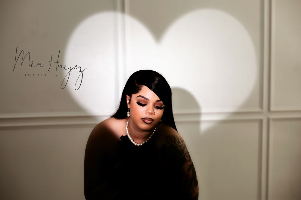 Dramatic studio portraits with artistic lighting and shadow play against white paneled walls.