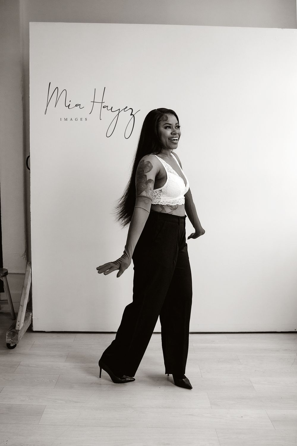 Artistic black and white photo series showing dynamic dance movements against a white studio backdrop.