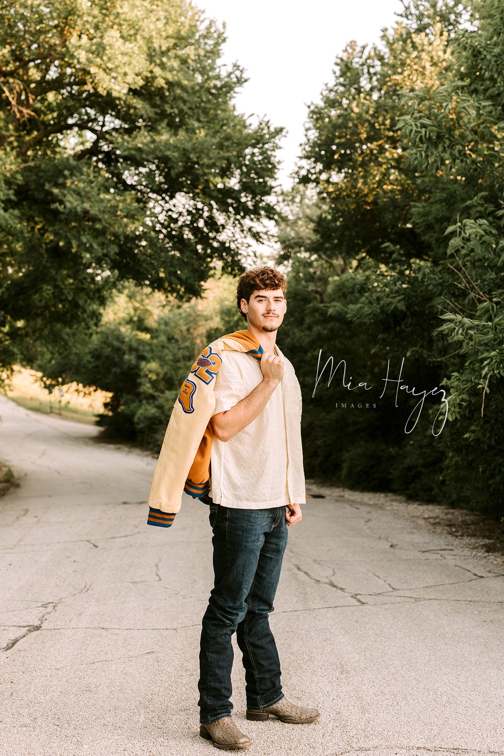 Series of casual poses on a paved path surrounded by green trees in casual attire.