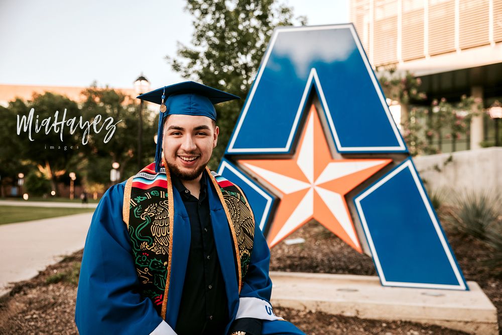 Graduation photos in front of blue star logo wearing traditional blue cap and gown.