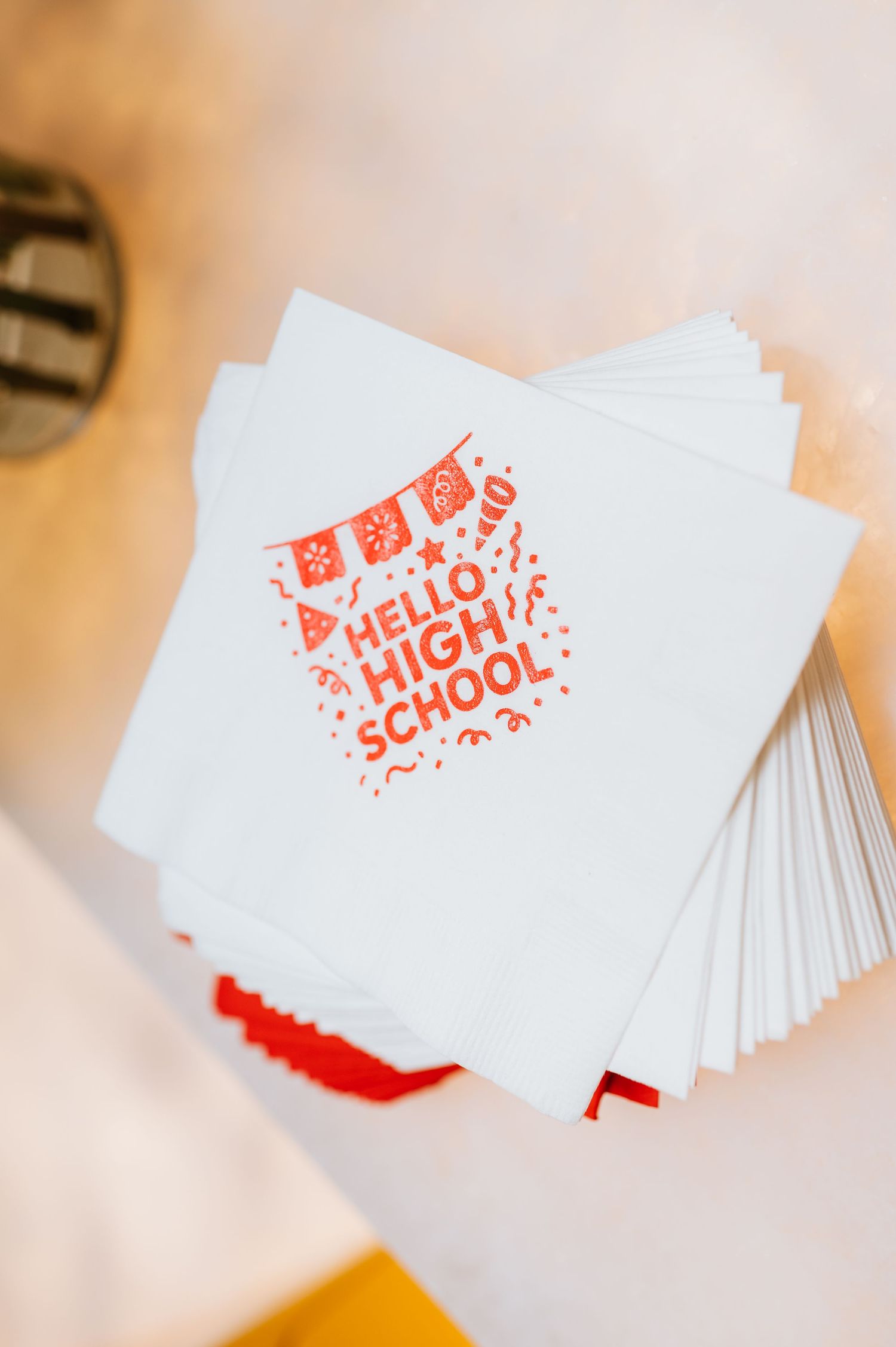 A stack of white business cards with red 'Hello School' text shown from different angles and perspectives.