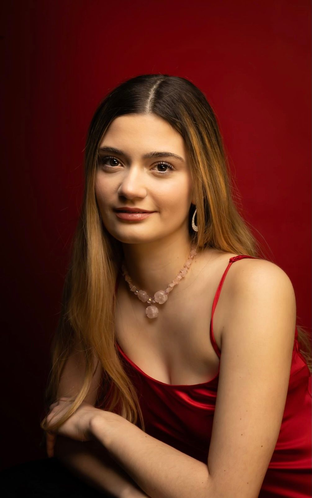 Girl in a red dress, side shot