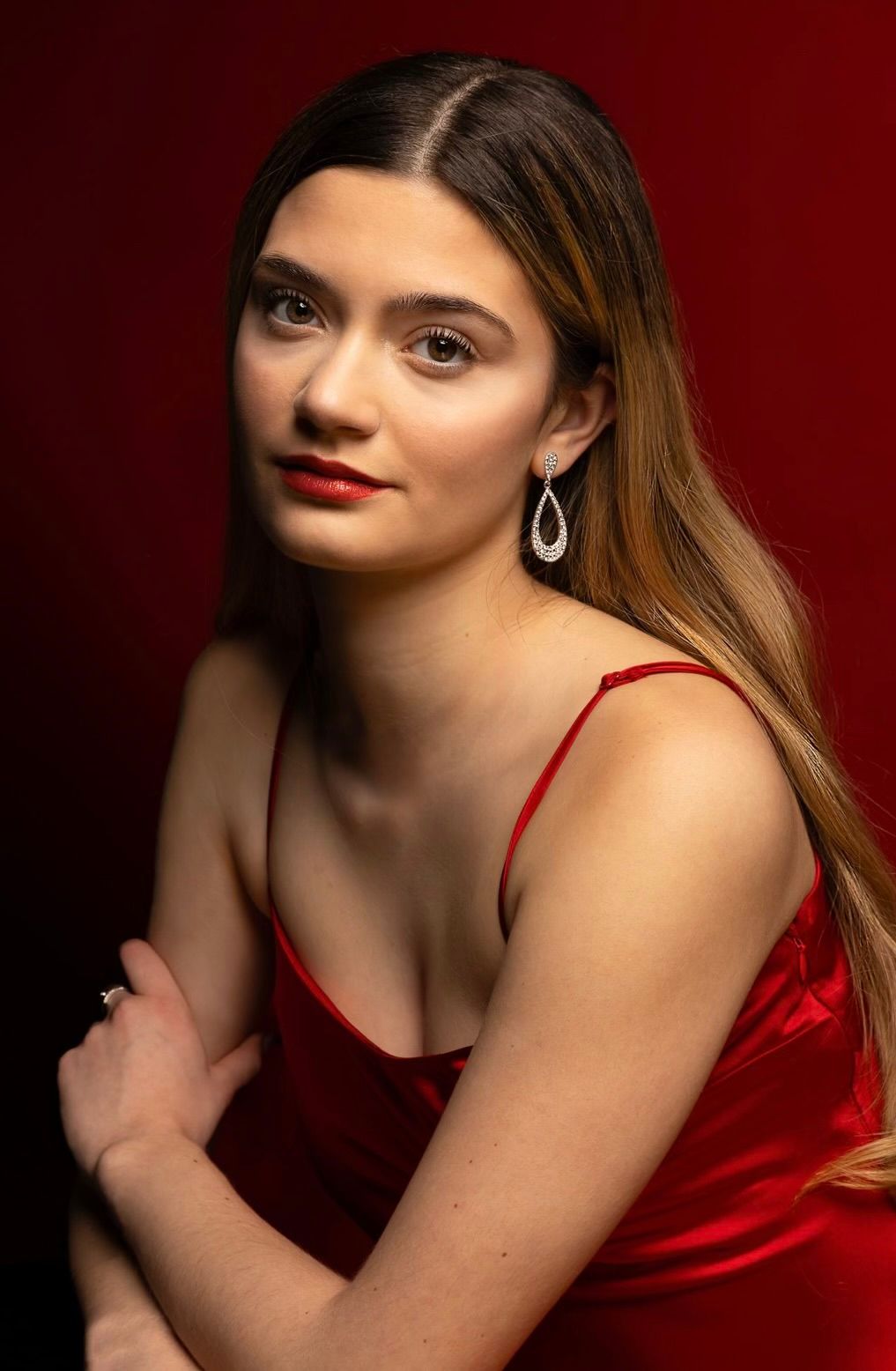 Girl in red dress, side shot, slightly down