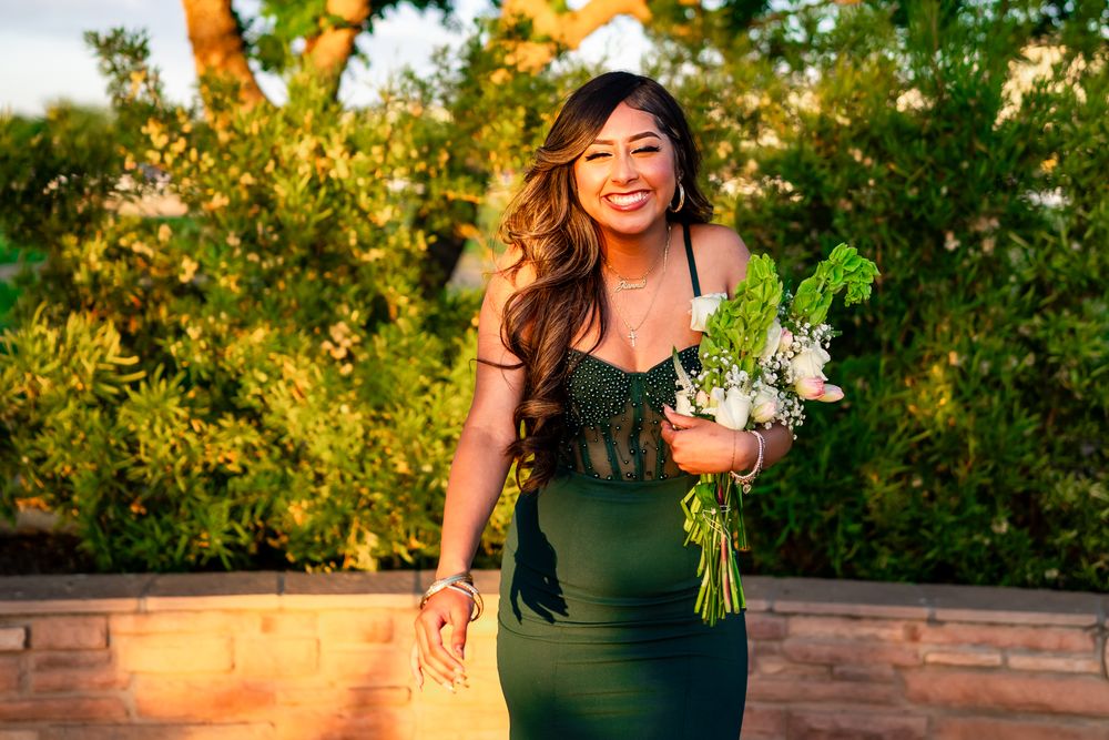Portrait session in garden with golden sunset lighting and greenery.