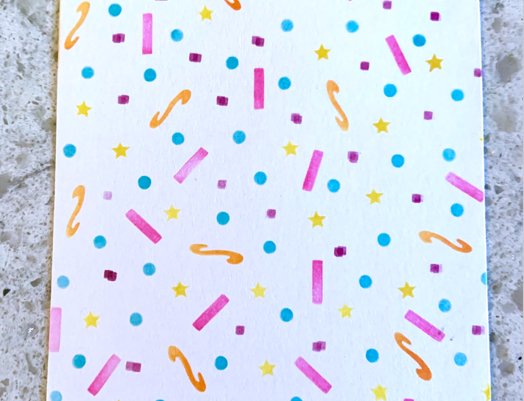 Card panel with confetti stamped design