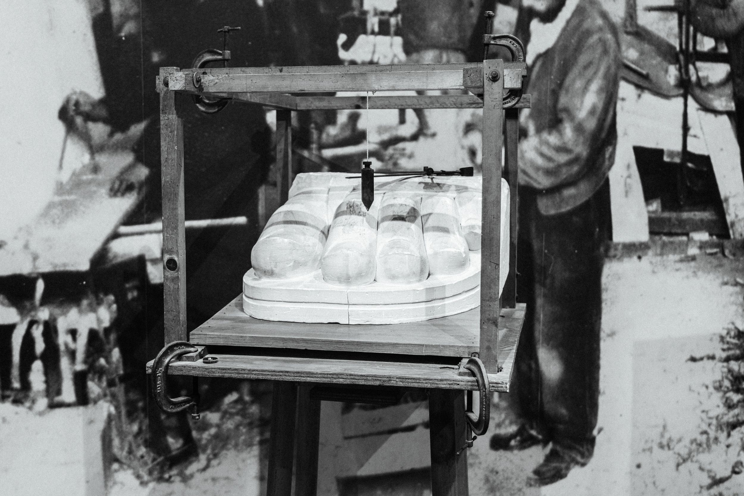 Historical black and white photographs of Liberty Island visitors and exhibits.