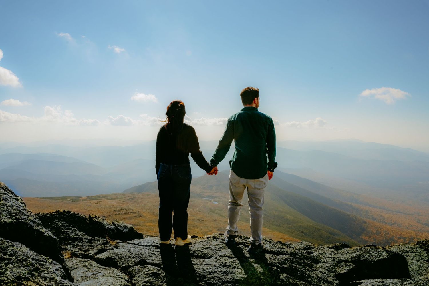 Memory Lane Studios couple silhouetted on Mt Washington mountain peak overlooking scenic valley engagement session by Tharun Palla