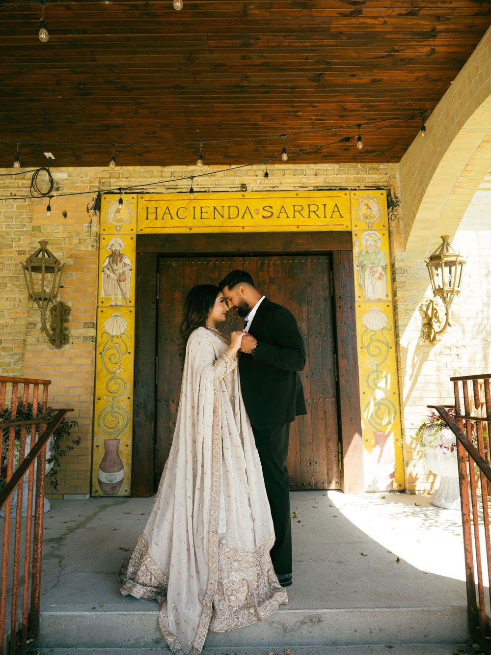 Wedding photos captured at Hacienda Sarria featuring rustic wooden beams and Spanish colonial architecture.