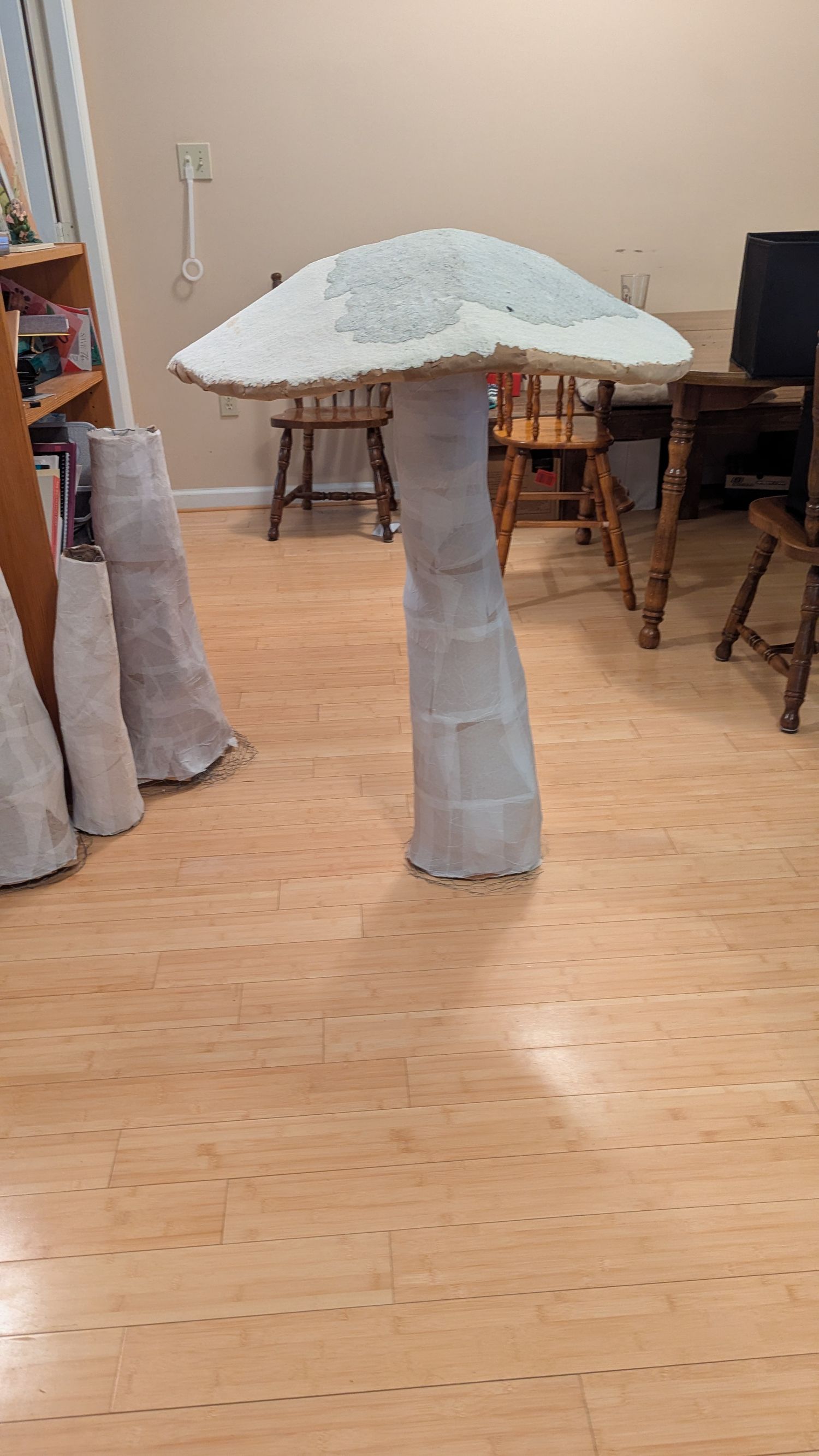 A giant mushroom is constructed but not painted.