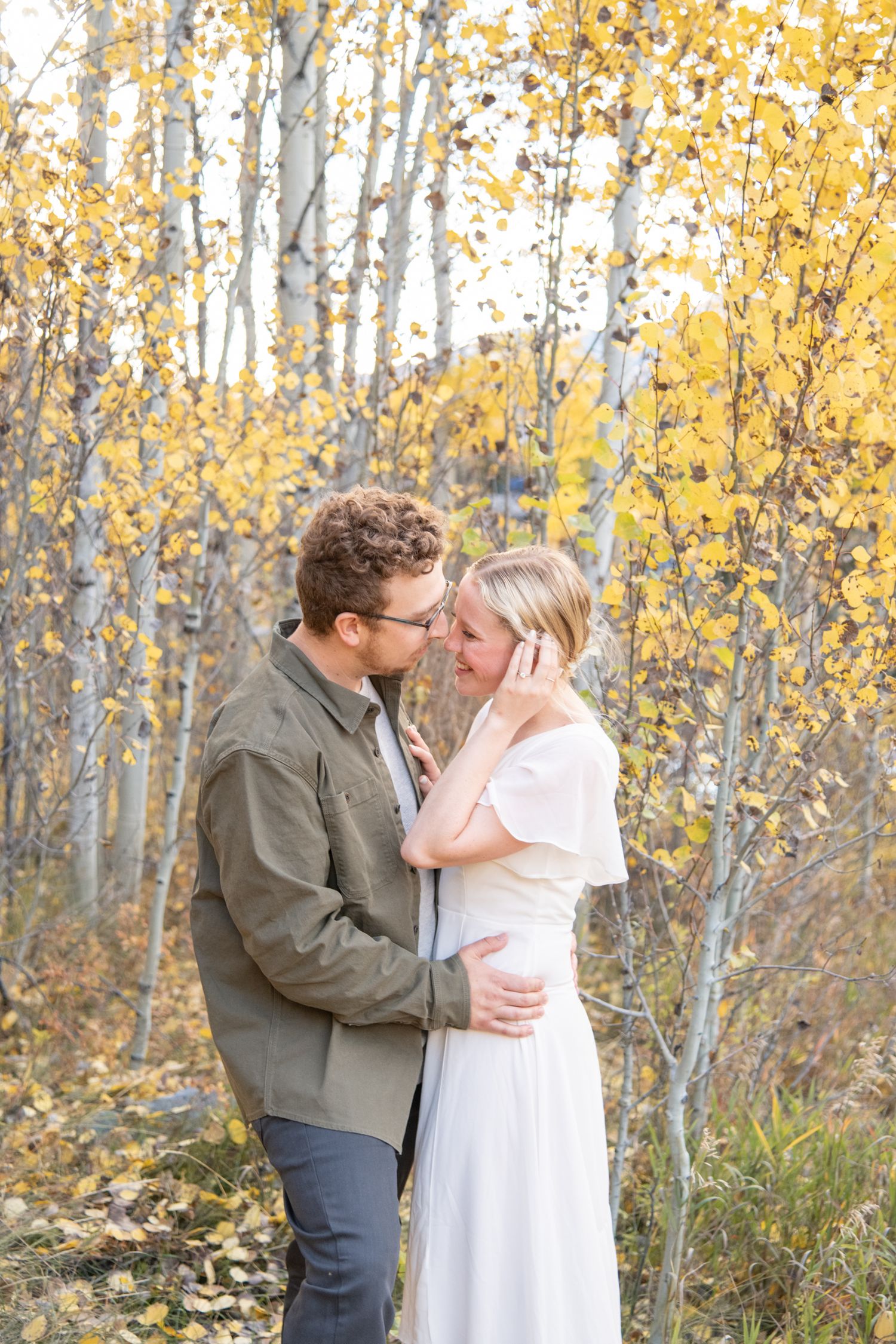 Vail engagement photographer captures cute couple in fall yellow aspen trees