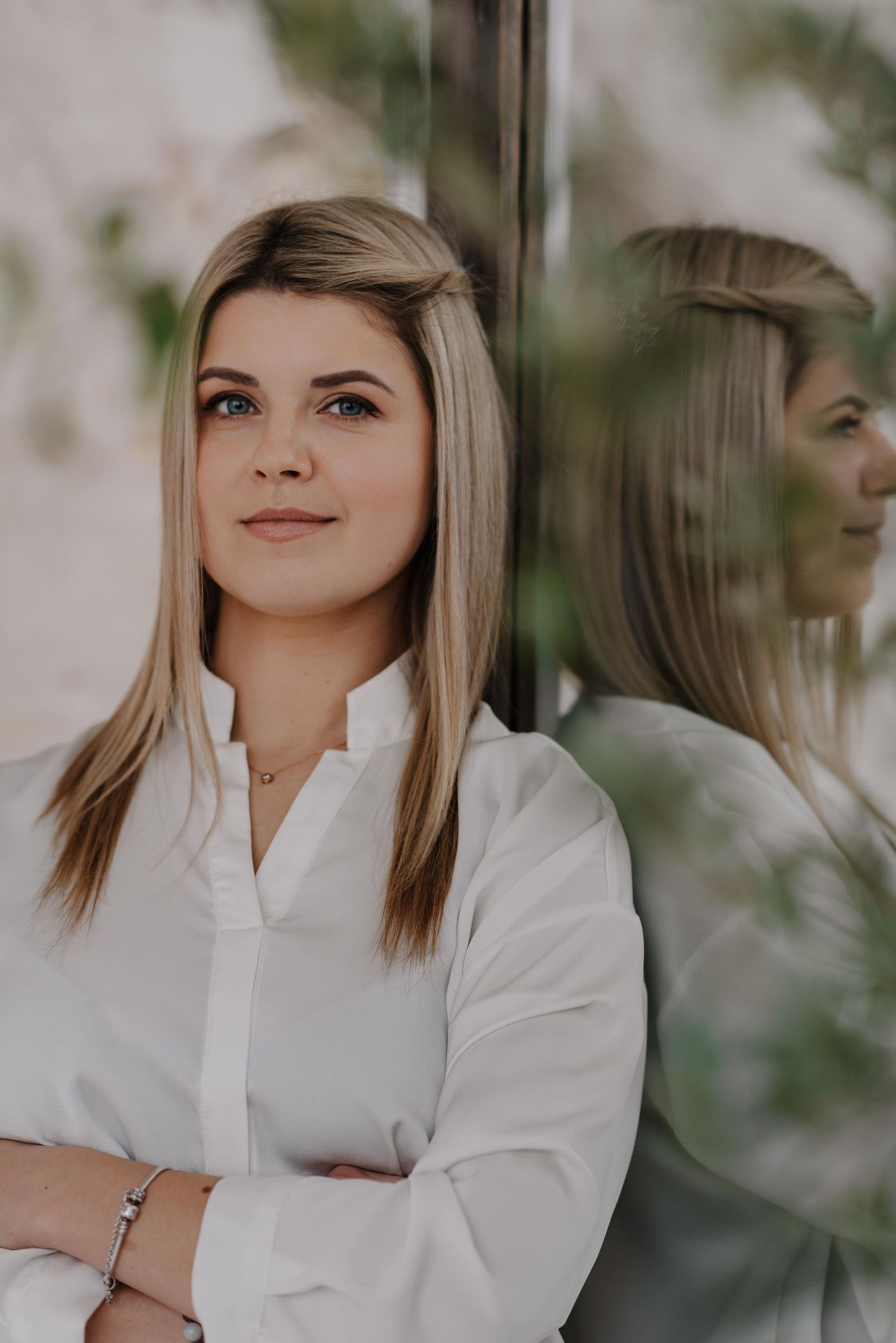 Portrait series in white clothing against a bright neutral background with soft focus.