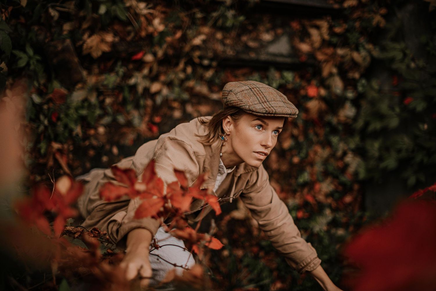 Portrait session featuring vintage style clothing against red autumn foliage.