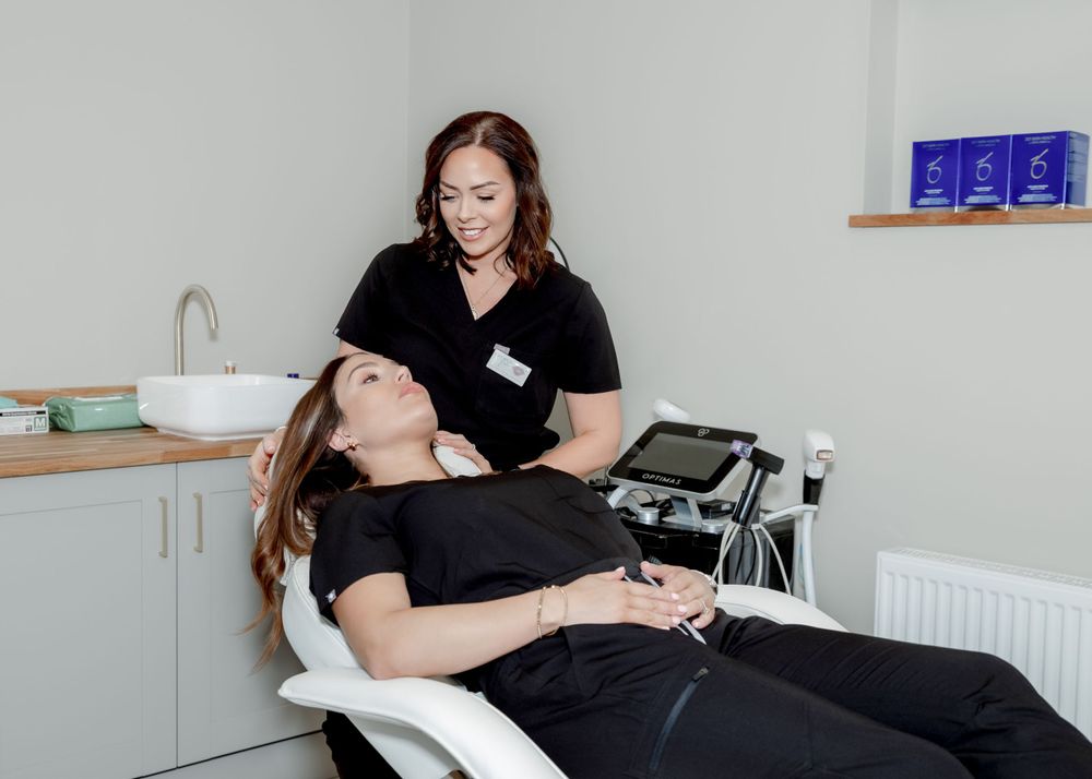 Aesthetic treatment being performed in modern medical office setting.