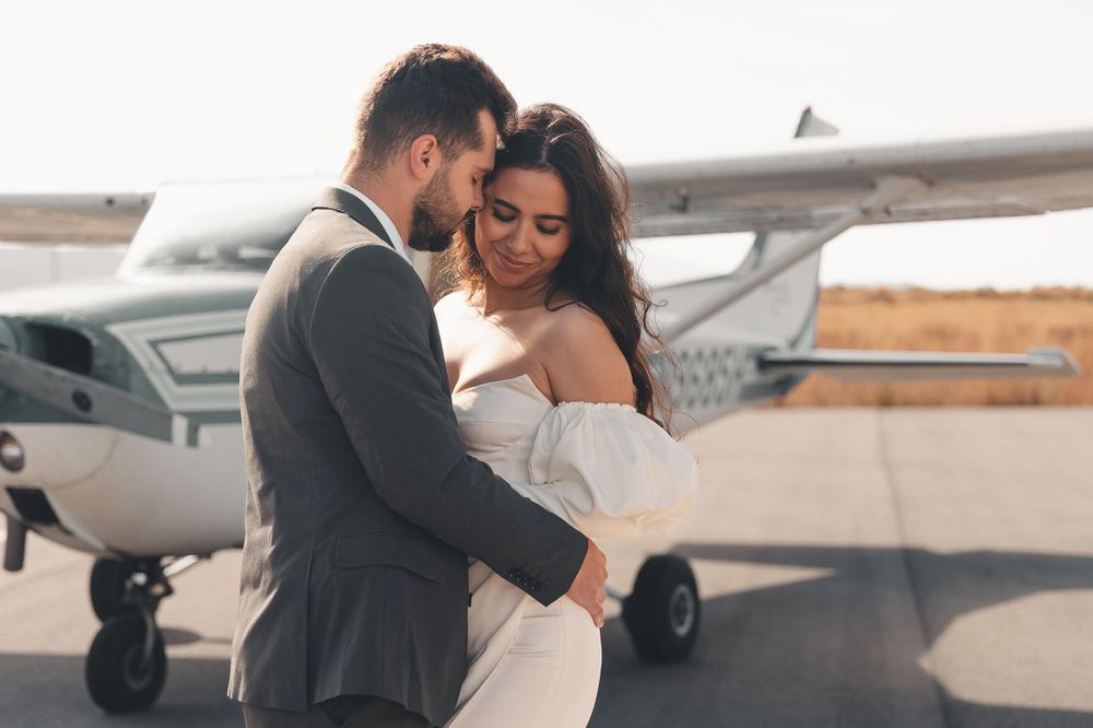 An editorial-style moment at Nephi Municipal Airport in Utah — modern romance takes flight with bold elegance and timeless allure.