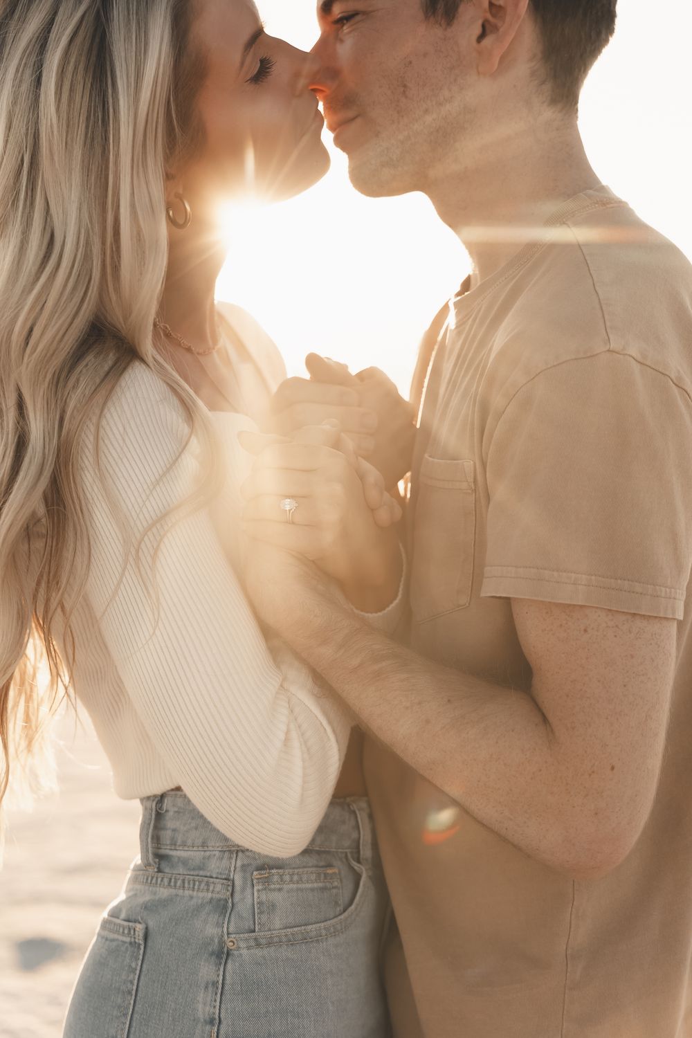 Dreamy sunset engagement session at the Bonneville Salt Flats in Utah — golden light, genuine kisses, and an epic, windswept love story.