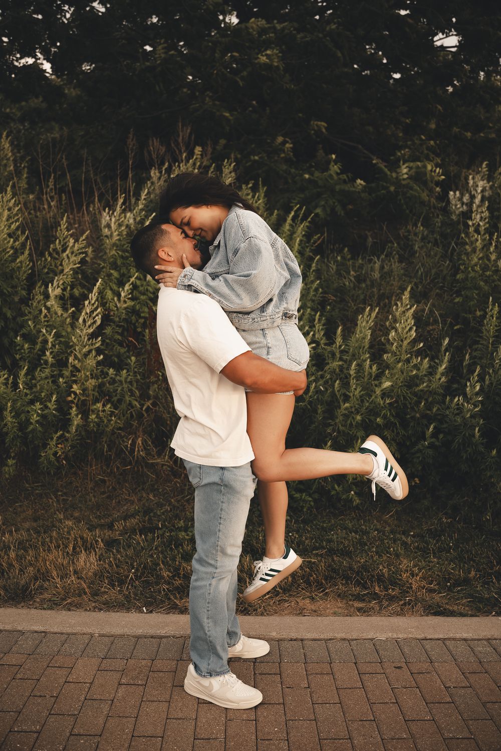 Playful, carefree love at the Lakewood Steps in Lakewood, Ohio — lifted high in each other’s arms, wrapped up in pure happiness & sunshine.