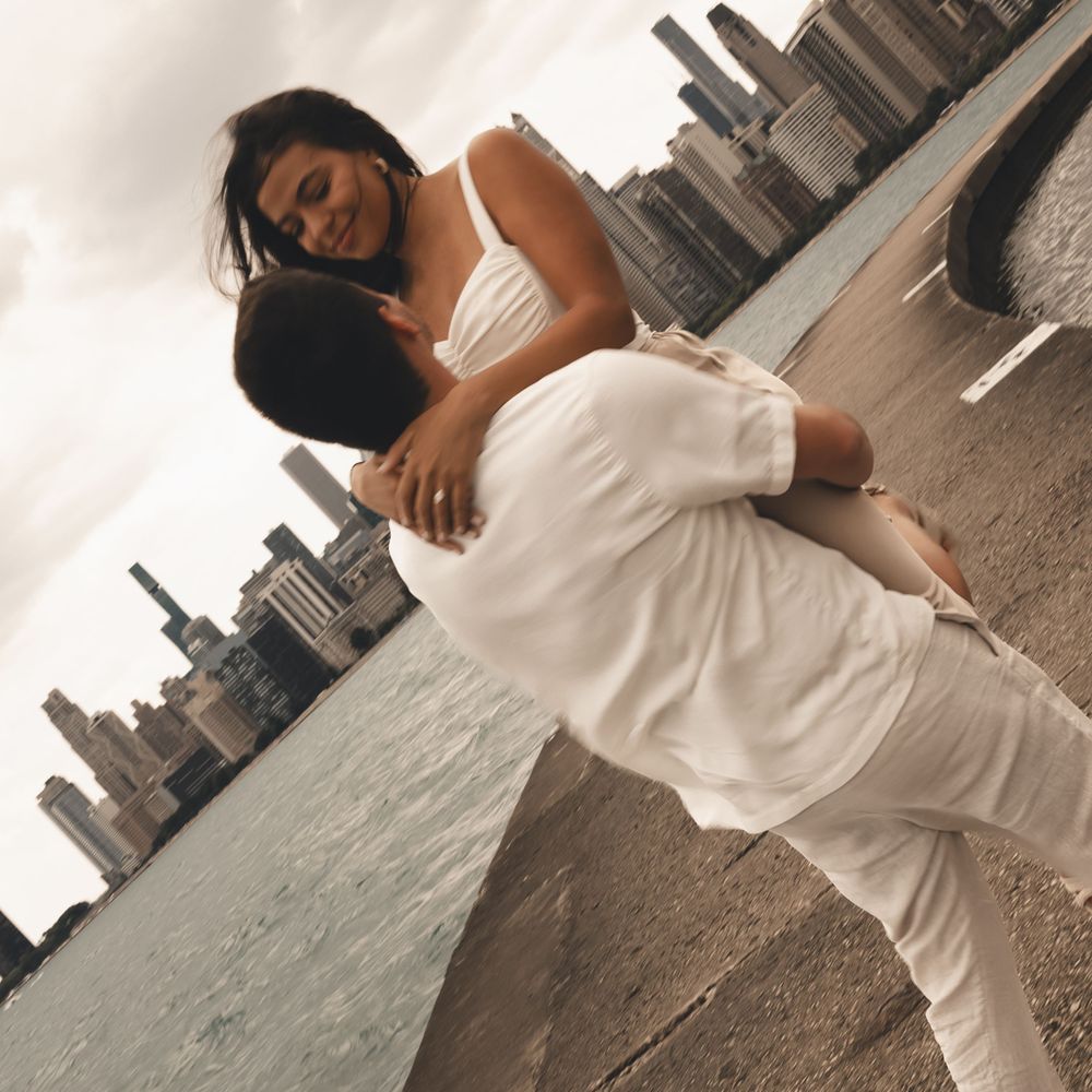 A windswept and dreamy Chicago lakeshore engagement session, city skyline views and soft romance captured in this beautiful downtown moment.