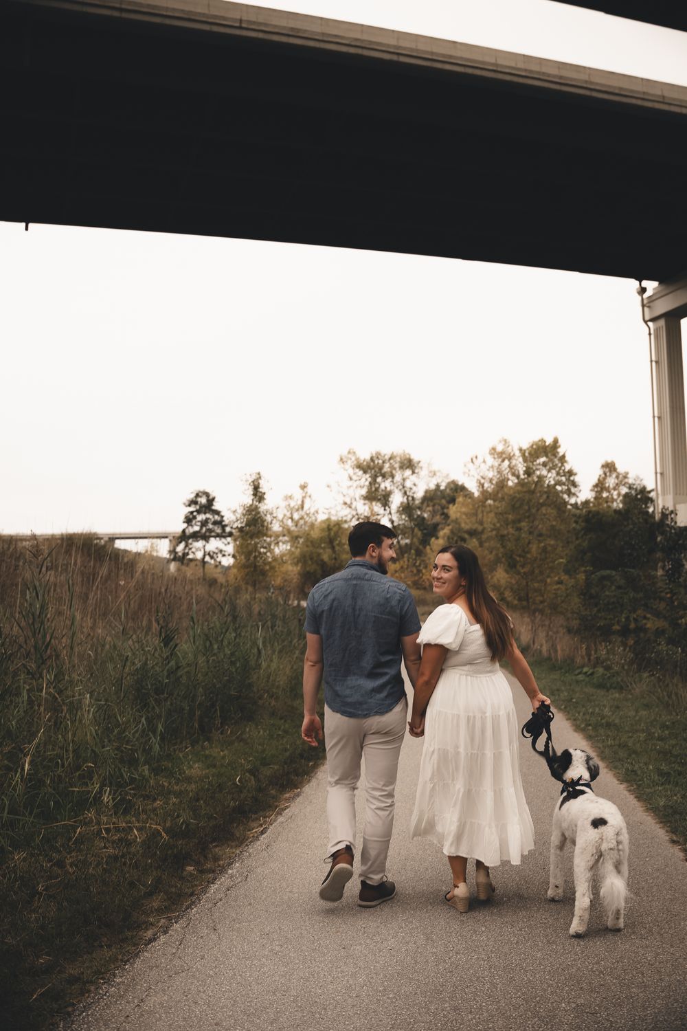 Sweet engagement session at Cuyahoga Valley National Park — strolling with their pup, capturing candid love and laughter on the trails.