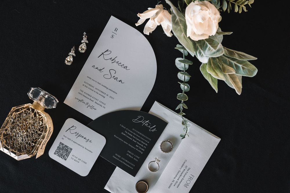 Elegant wedding details at The Harper in Meadville, PA — invites, rings, florals, and vows that tell this couple’s timeless love story.
