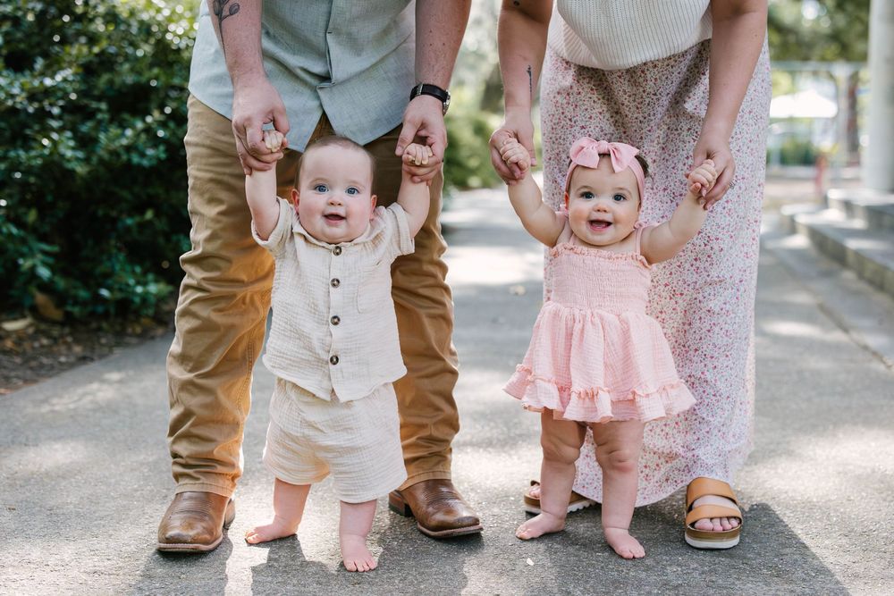 Close-up detail shots of feet and legs of family members standing together on a path outdoors.