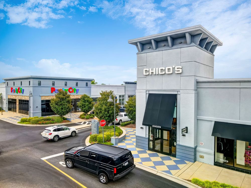 Modern Chico's retail store exterior with contemporary architecture and parking area.