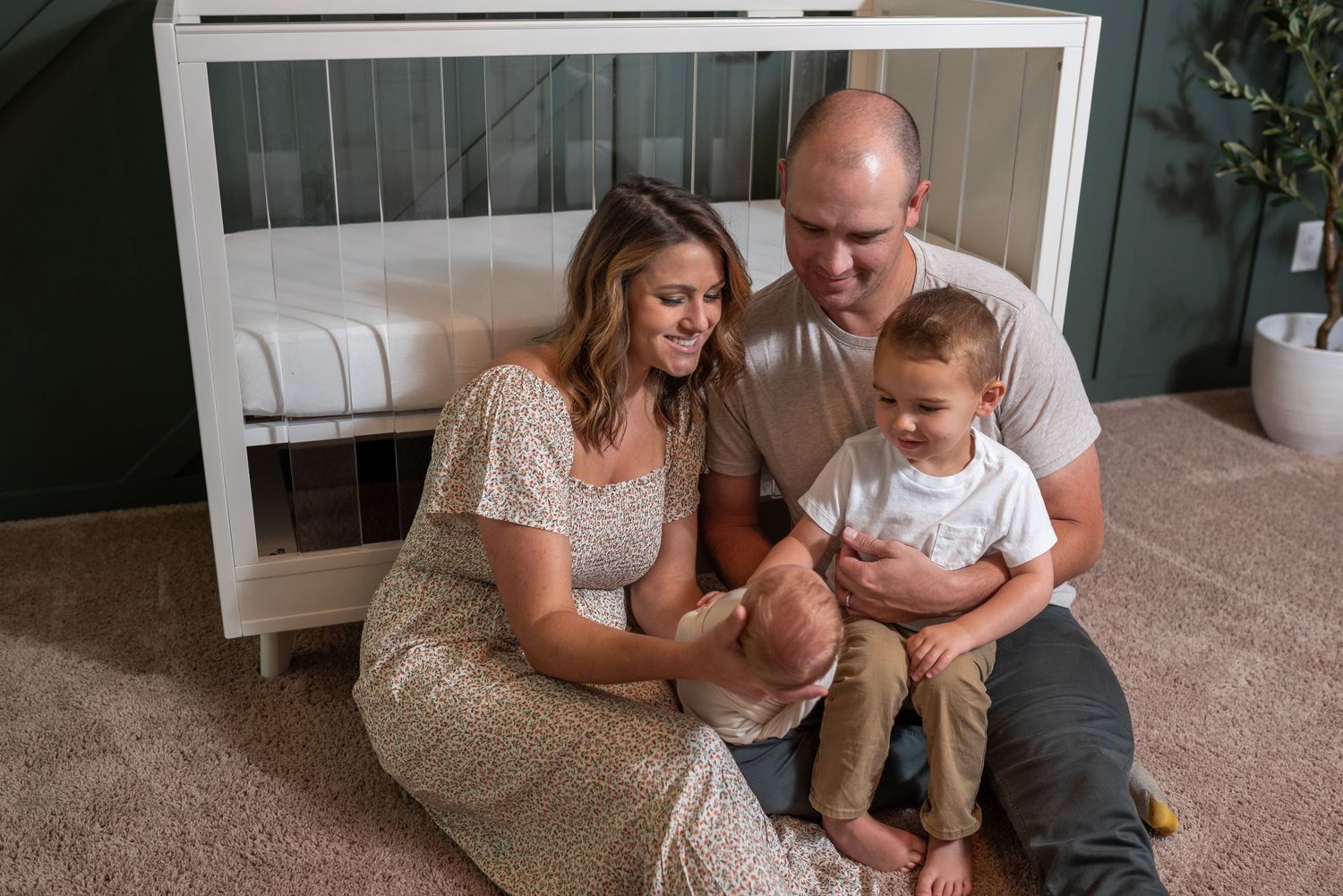 Family gathered on floor sharing tender moments together.