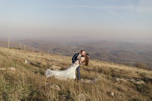 A series of panoramic landscape photos showing rolling hills and mountains under a cloudy sky.