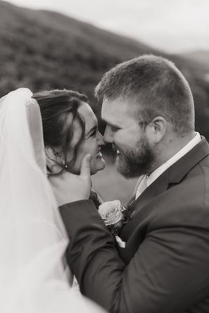 Series of intimate wedding photos showing couple in embrace, from far to close up, sharing a romantic kiss.