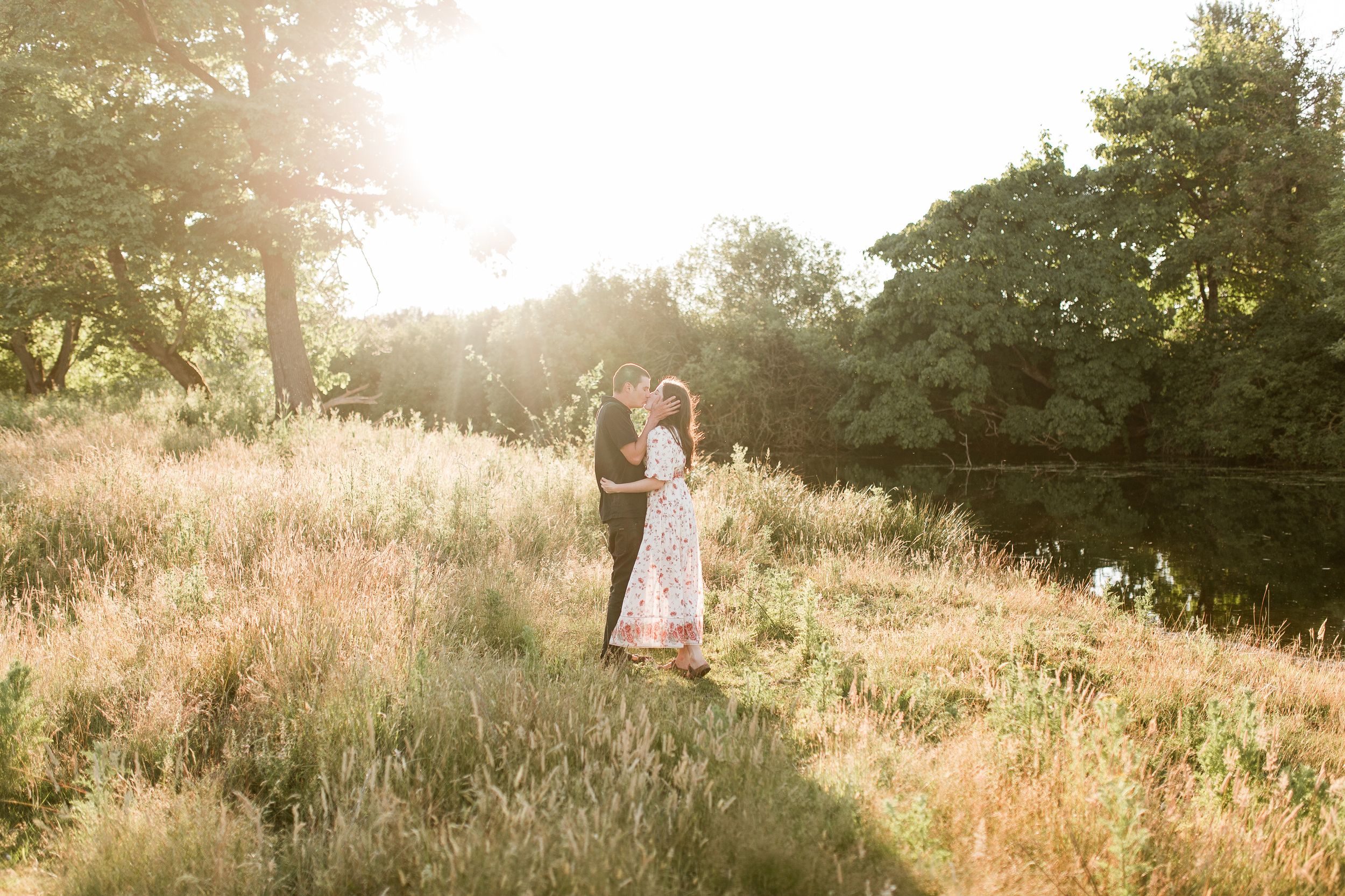 Romantic sunset photoshoot in a sun-drenched meadow with tall grass. Creekside Farm photo shoot. Eugene, Oregon couples photography.