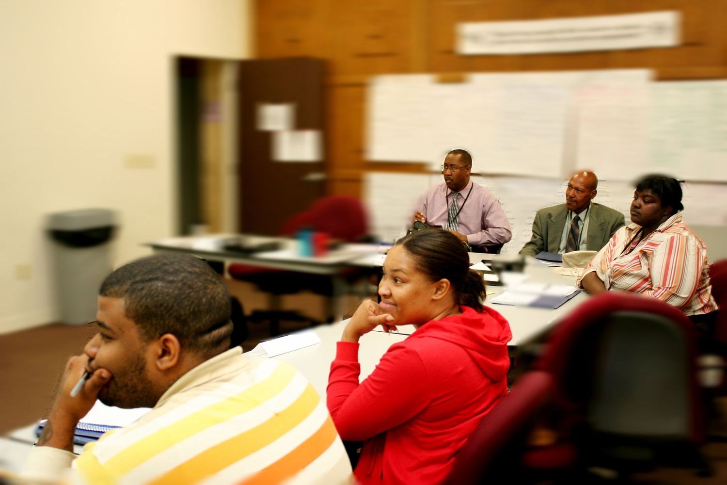Students listening attentively during a classroom meeting or seminar session.