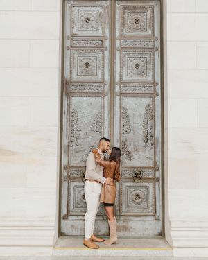A couple poses together in front of ornate vintage white doors in three romantic engagement photos.