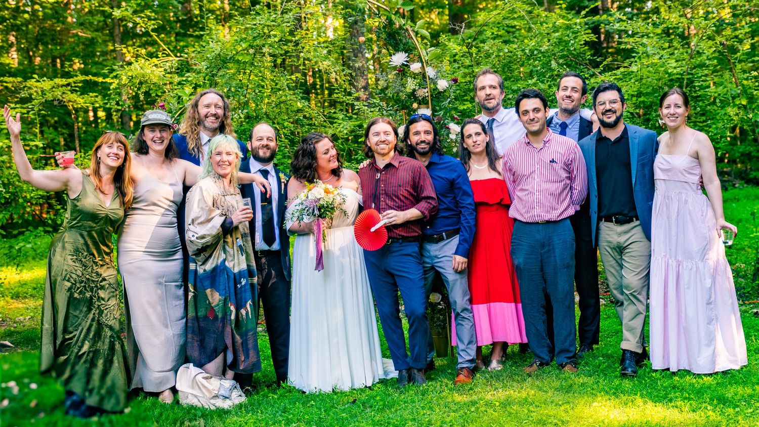 A panoramic collage of wedding guests gathered outdoors on a lush green lawn during a sunny summer celebration.