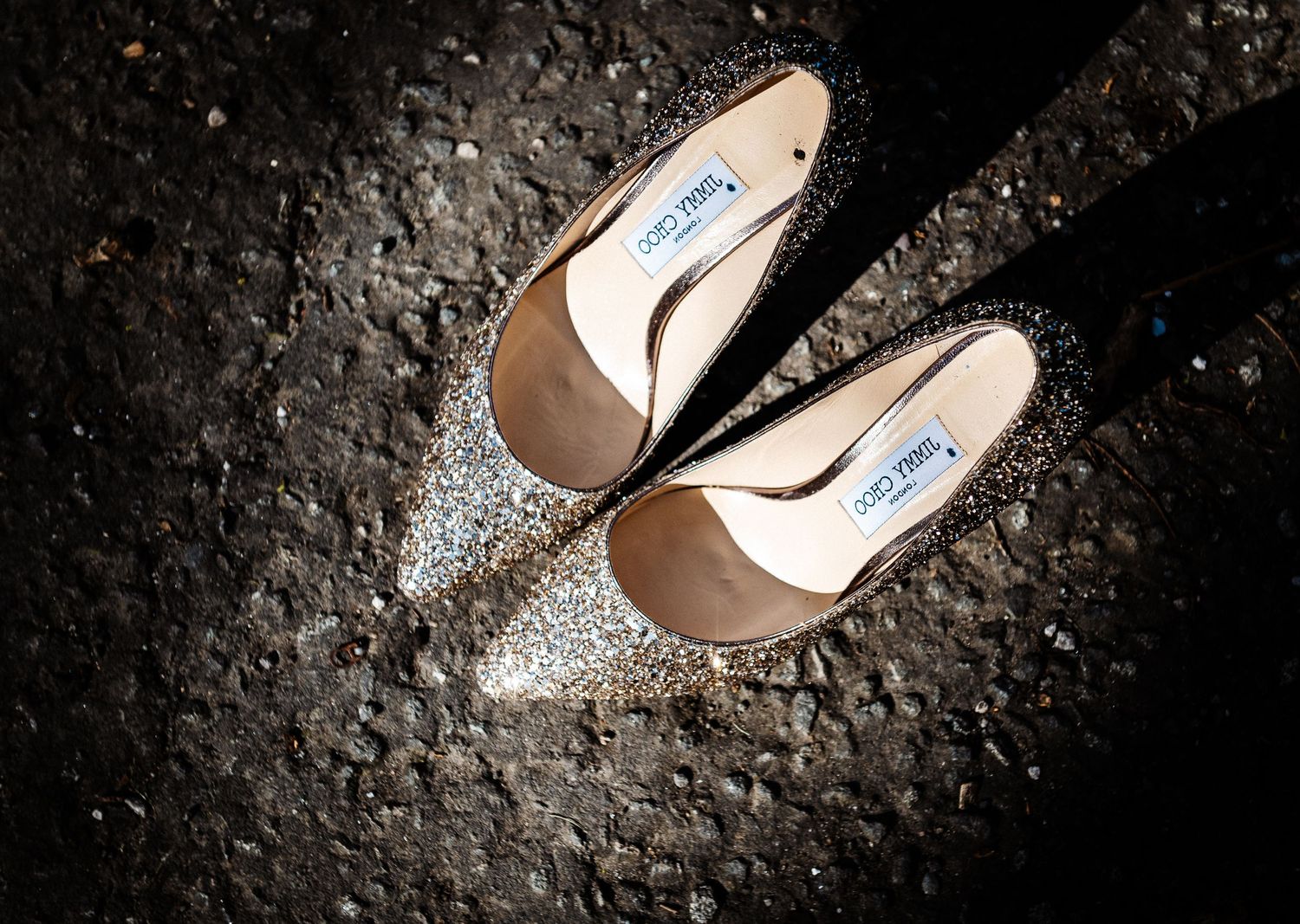 Seven sequential images show a high heel shoe stepping into a puddle of water creating ripple effects and reflections.