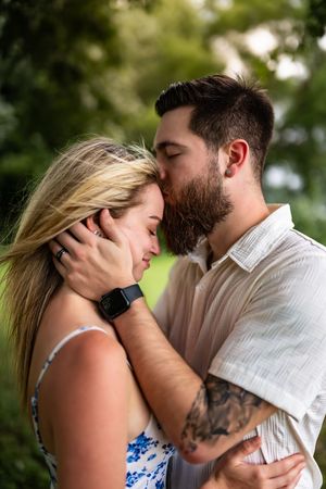 A romantic couple shares intimate moments together in a series of close-up portraits against a natural outdoor background.