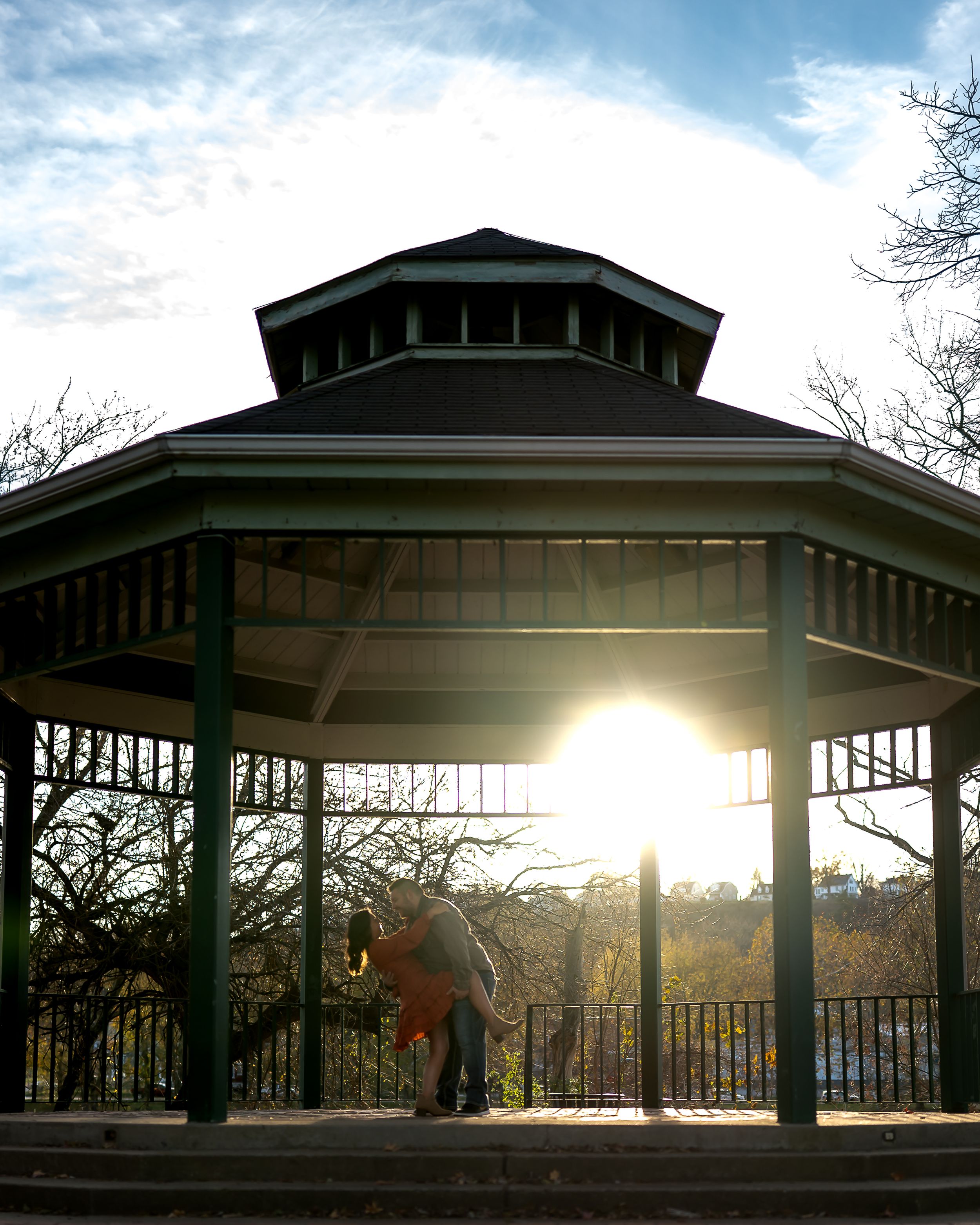 A panoramic series of four photos showing a covered gazebo at sunset with sunlight streaming through its pillars.