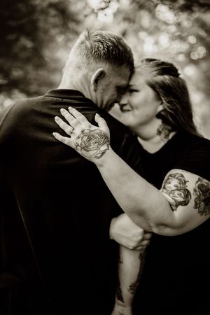A series of black and white photos showing an intimate couple kissing in a romantic artistic sequence.