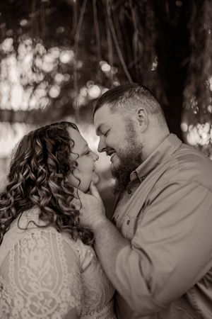 A romantic black and white photo series showing a couple kissing tenderly in multiple close-up shots.