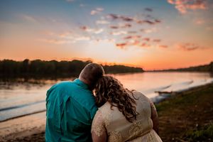 A series of romantic silhouette photos at sunset showing a couple embracing on a beach with orange and pink sky.
