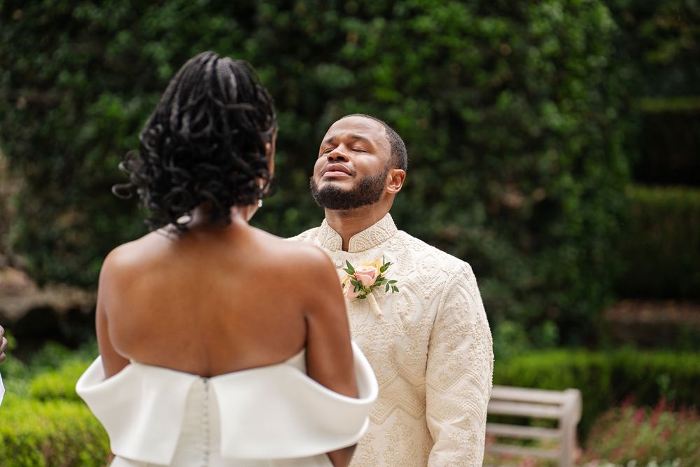 groom showing emotion at altar