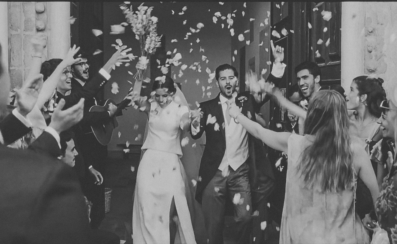 Loving wedding couple shares tender moments in a rustic outdoor setting.