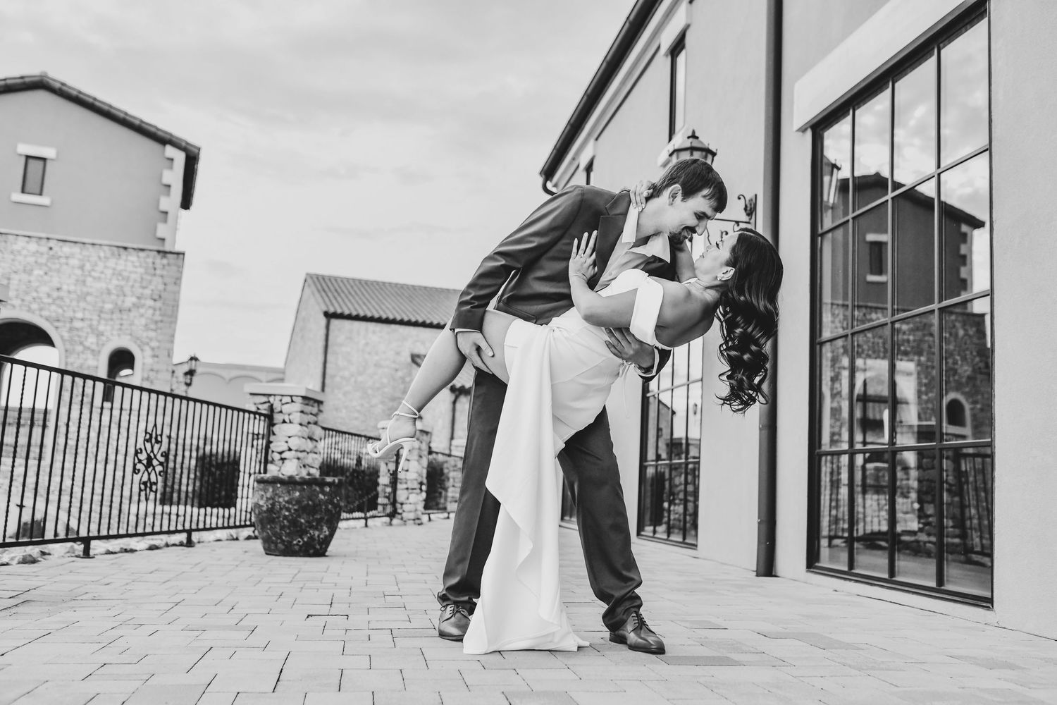 Bride-to-be in an off-the-shoulder white dress during her North Texas engagement session