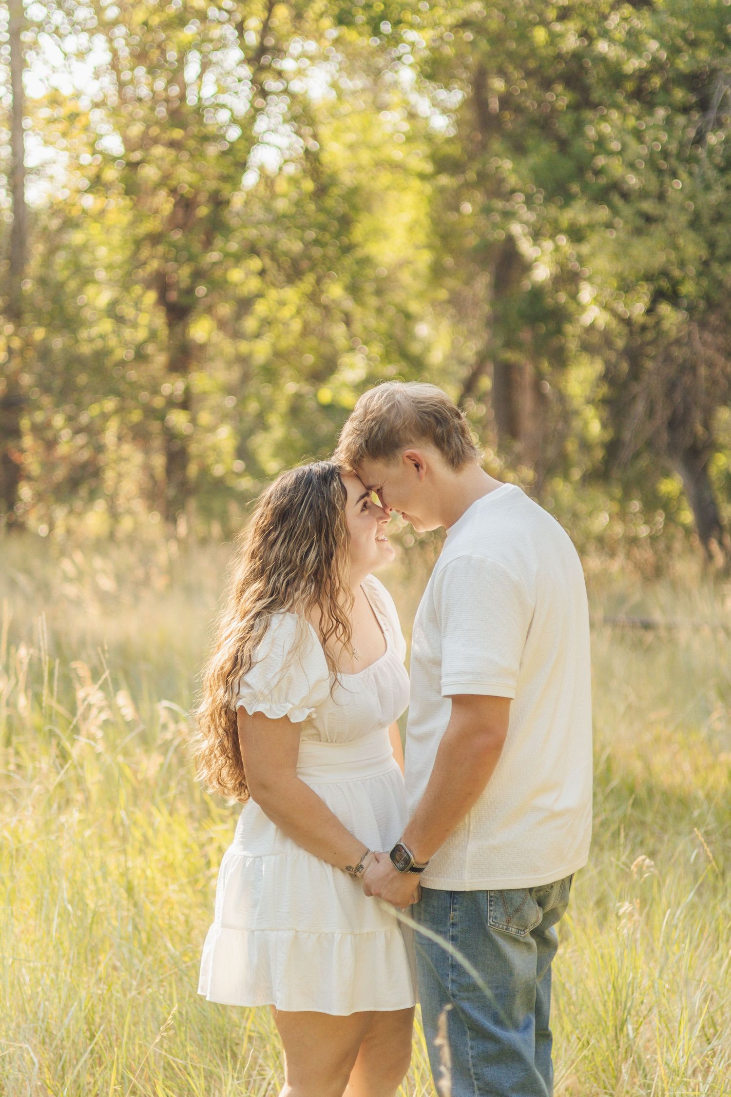 Couple looking into each others eyes for engagement session in Northern Utah