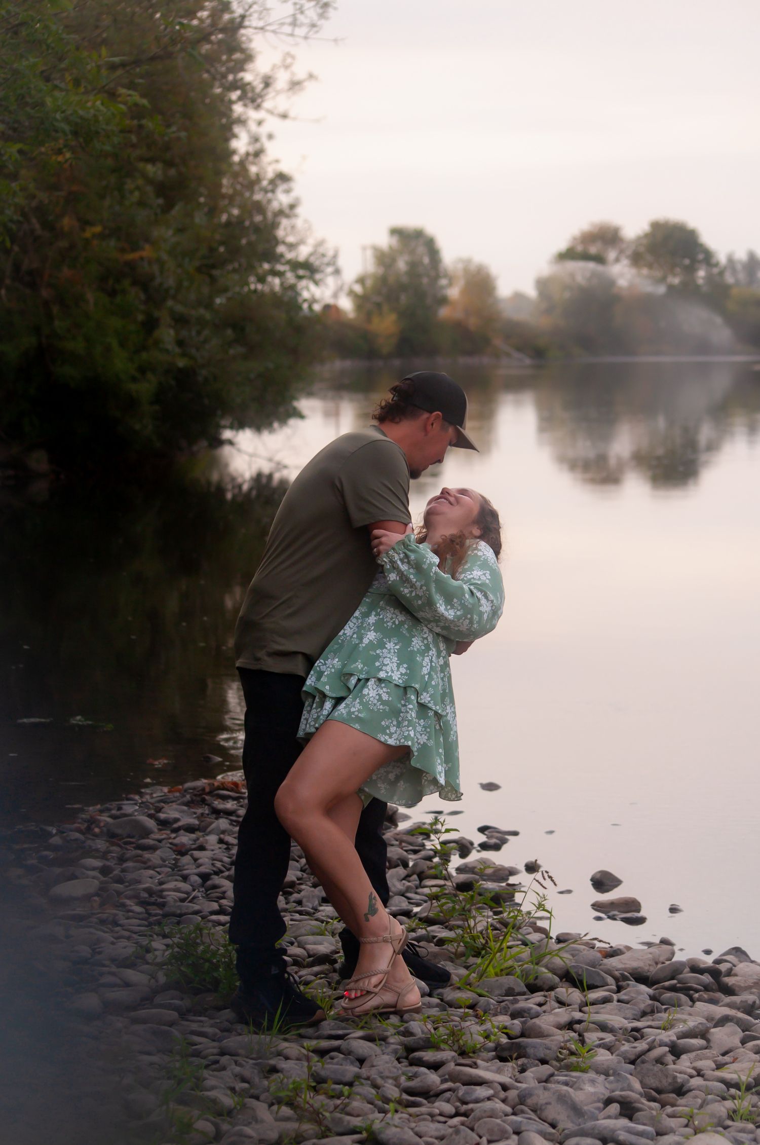 A Dip kiss in front of a stunning river