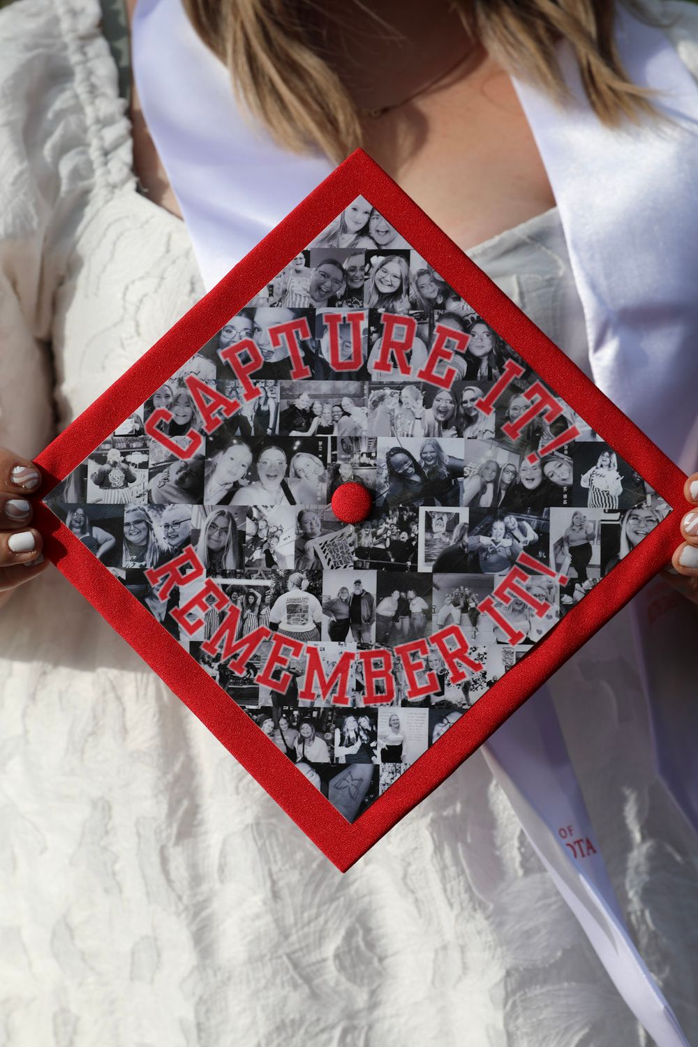 Decorated graduation cap with red border, black and white photo collage, and text reading Capture It Remember It.
