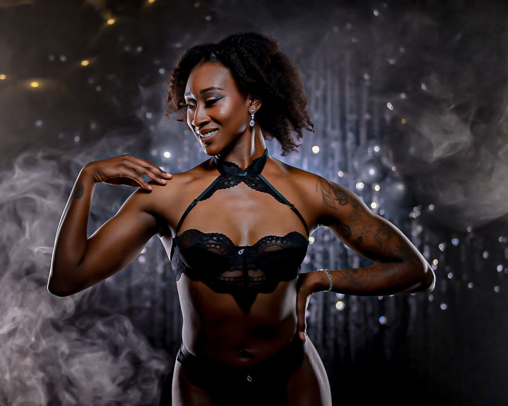 Dramatic dance performance with sparkles and dark lighting effects.